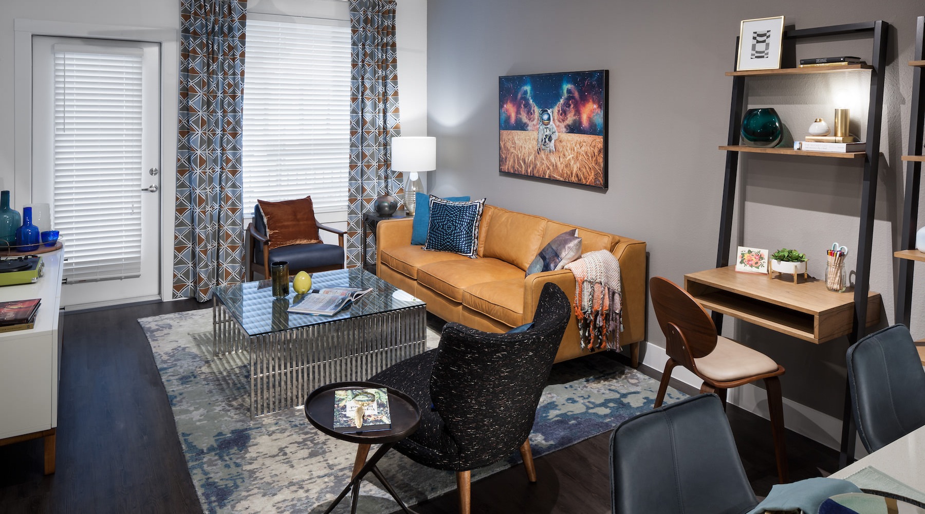 Spacious well lit living room with wood floors 